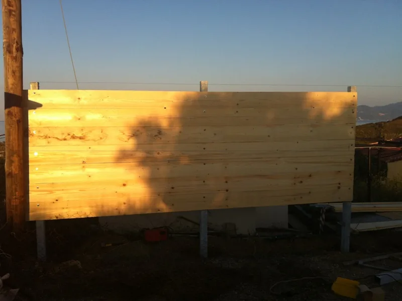 The new fence that cuts off the road lights